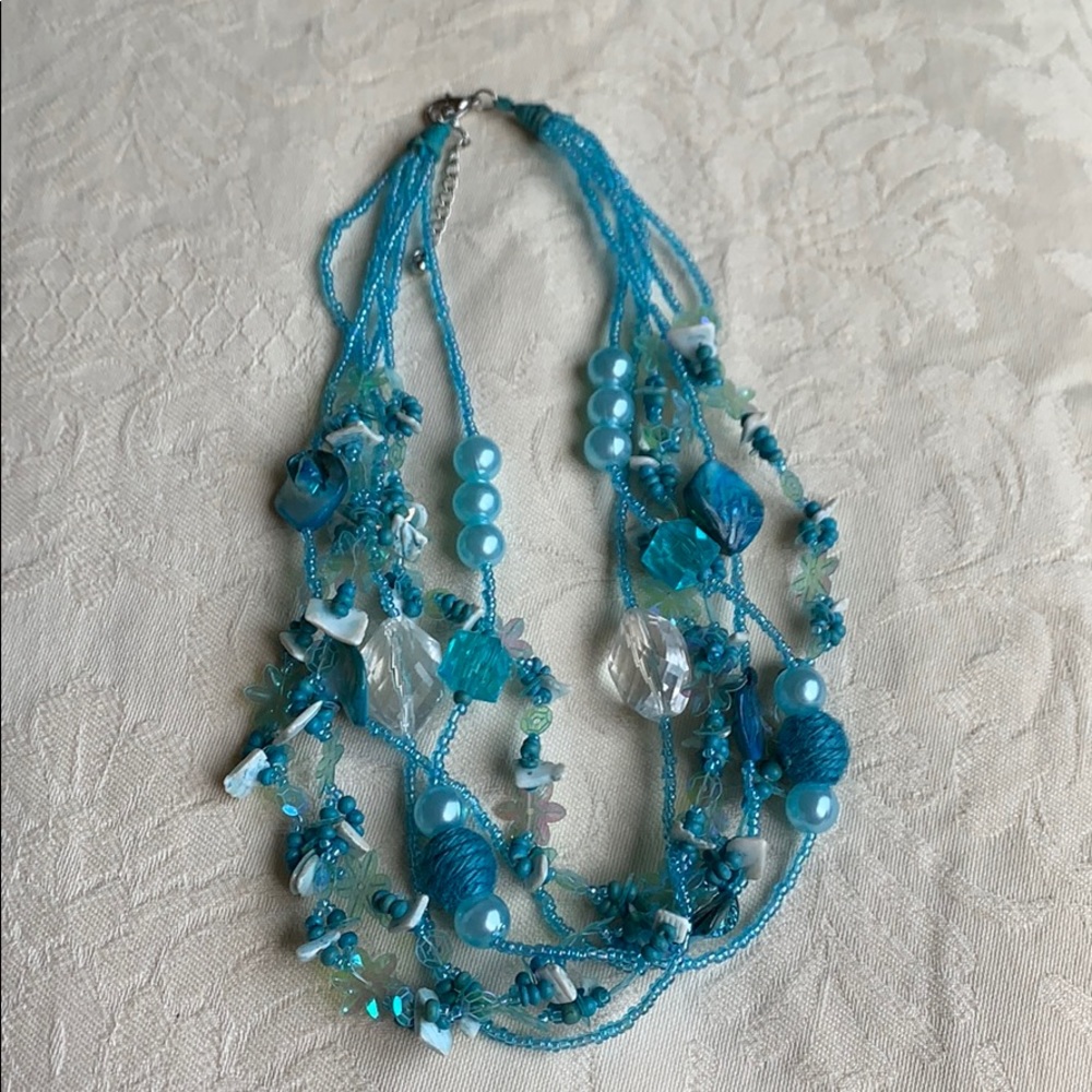 A blue recycled necklace.